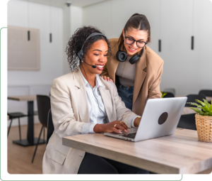 Two women collaborating on a laptop