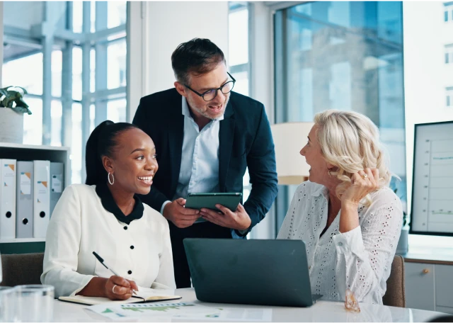 Business professionals collaborating in bright office