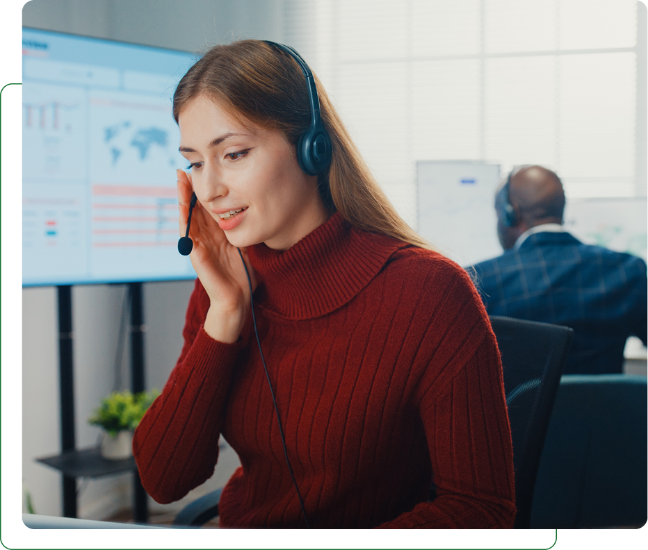 Call center agent wearing headset at desk