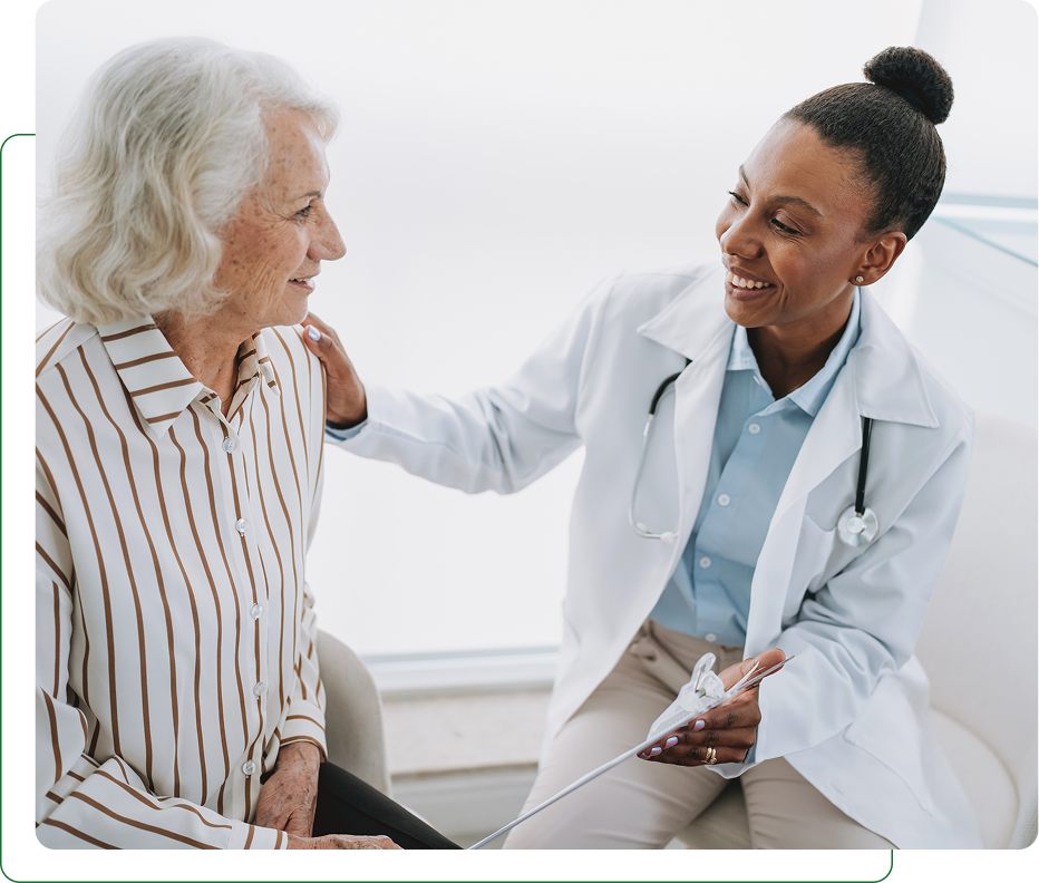 Doctor comforting elderly patient during medical consultation