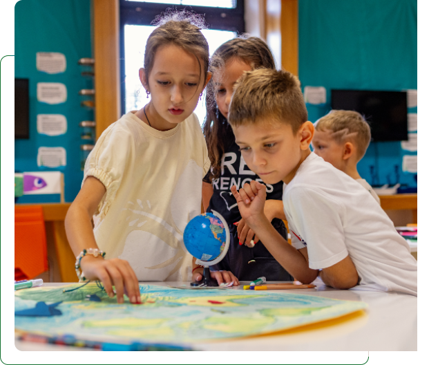 Children learning with globe and map